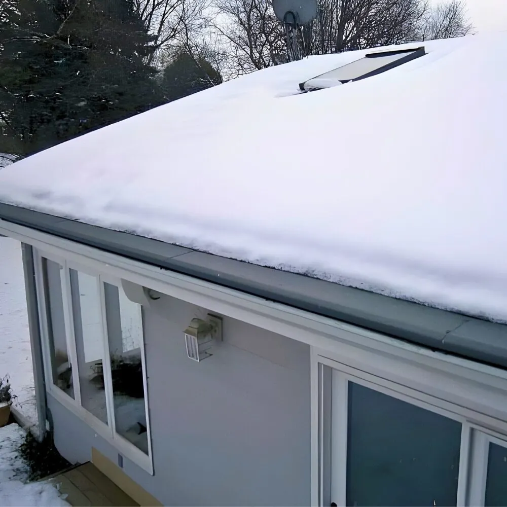 Gutter Helmet edge on a snowy roof